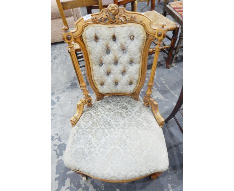 Late Victorian lady's nursing/salon chair having button upholstered shield-shaped back flanked by reeded and turned supports,