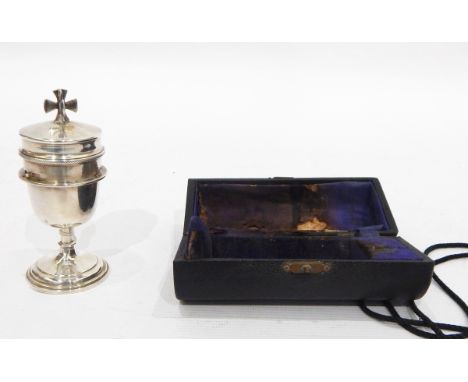 Silver travelling communion set by A R Mowbray & Co Ltd, London 1966, the bowl of the chalice with engraved decoration, on kn