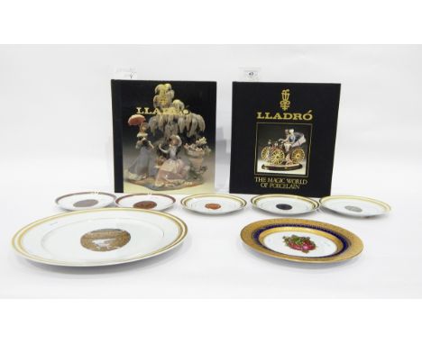 Quantity of collector's china plates depicting Faberge eggs and two hardback copies of Lladro "The Art of Porcelain" and "The