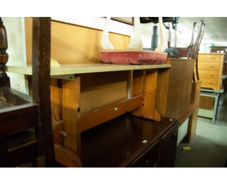 A FORMICA TOPPED BENCH SEAT ON PINE TRESTLE SUPPORTS AND A WHITE FINISHED DRESSING STOOL, BUTTON UPHOLSTERED IN PINK VELVET O