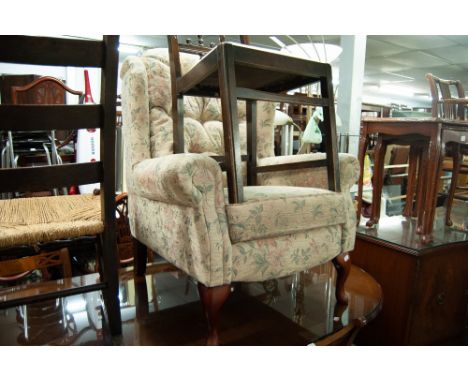 BUTTON UPHOLSTERED WINGED EASY ARMCHAIR, CHAIR COVERED IN FAWN AND FLORAL FABRIC ON CABRIOLE FRONT SUPPORT
