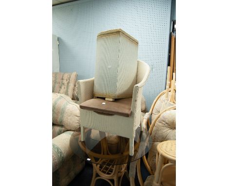 A WICKER COMMODE CHAIR, a MATCHING D-SHAPED LINEN BASKET AND TWO PORTABLE RADIATORS (4) 