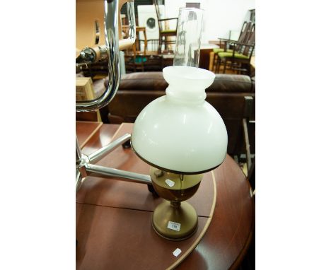 BRASS AND WHITE GLASS OIL TABLE LAMP, of typical form with domed shade and clear glass chimney, 25" (63.5cm) high overall