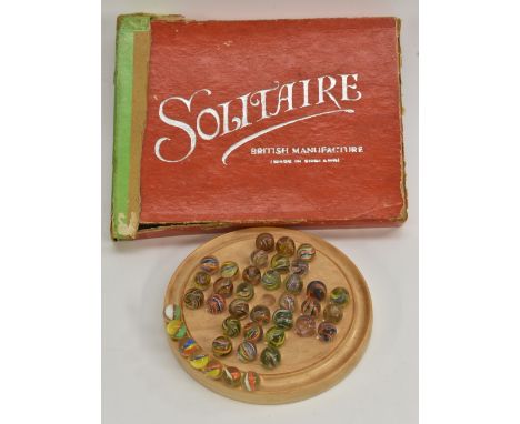 Games - a British thirty two glass marble and wooden solitaire set, circular light wooden base board, thirty two mixed colour