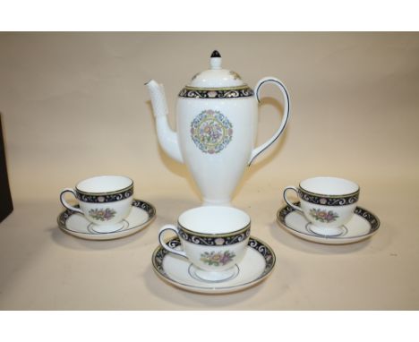 A WEDGWOOD RUNNYMEDE COFFEE POT AND THREE CUPS AND SAUCERS 
