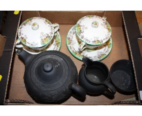 A WEDGWOOD BLACK BASALT THREE PIECE TEA SERVICE A/F TOGETHER WITH A PAIR OF SPODE BYRON LIDDED CUPS 