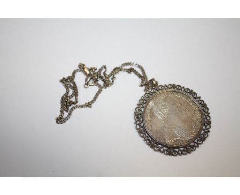 A COIN PENDANT ON SILVER CHAIN