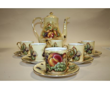 AN AYNSLEY ORCHARD GOLD COFFEE POT AND SET OF SIX AYNSLEY ORCHARD GOLD COFFEE CUPS AND SAUCERS 
