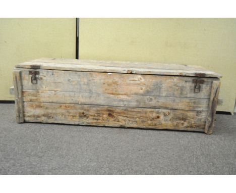 A large pine storage trunk, containing a selection of tools and petrol cans, the trunk measuring 150cm wide