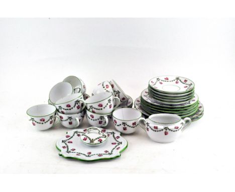 A Continental porcelain tea service printed with pink roses and green husk swags, early 20th century
