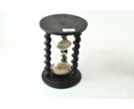 A sand timer with barley twist supports, 23cm high