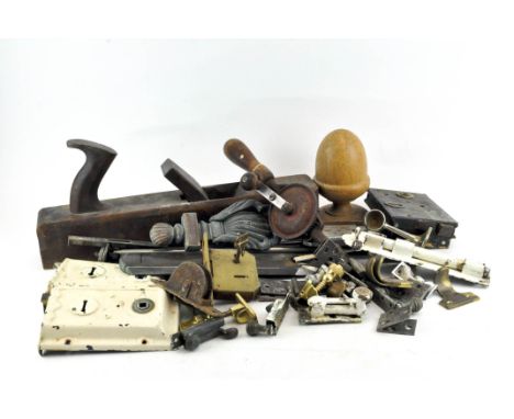 A collection of assorted items, including tools, a box plane, vintage door locks and knobs 