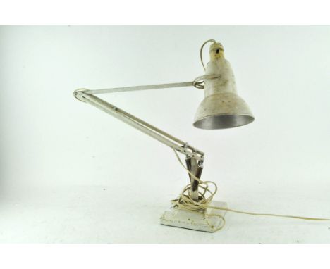 A white painted metal anglepoise lamp on square footed base, marked Herbert Terry