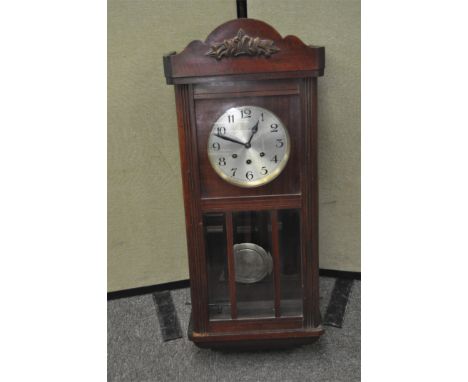 A mahogany cased wall clock, with pendulum, height 78cm