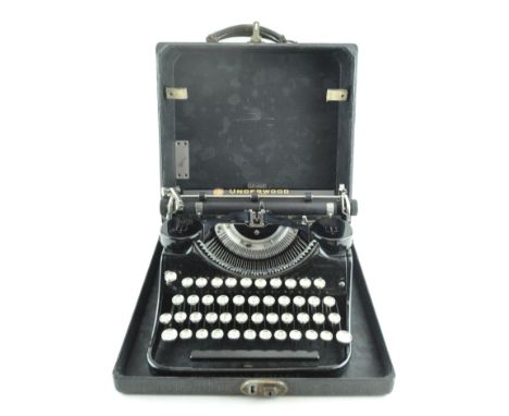 A vintage Underwood portable typewriter in original case, made in the USA