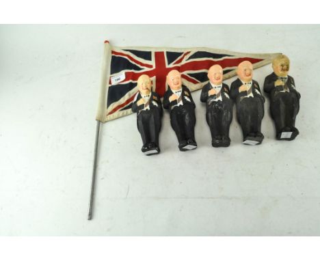 A collection of five figures of Winston Churchill in Black Tie smoking a cigar, together with a small vintage Union Flag, the