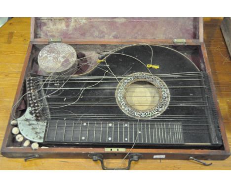 A zither, cased, and a cased geometry set