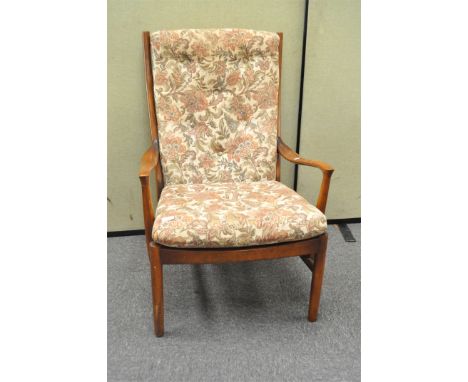 A Parker Knoll armchair, with button upholstery, 97cm high