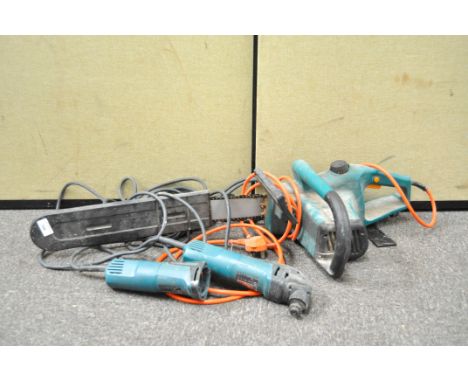 An electric chain saw and two Makita electric tools