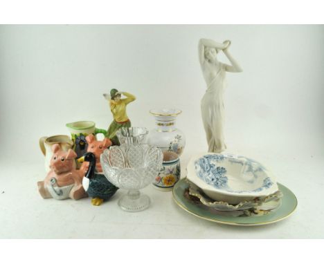 A collection of ceramics, including a Poole pottery pot, Wade Natwest pigs, a Royal Doulton and other items