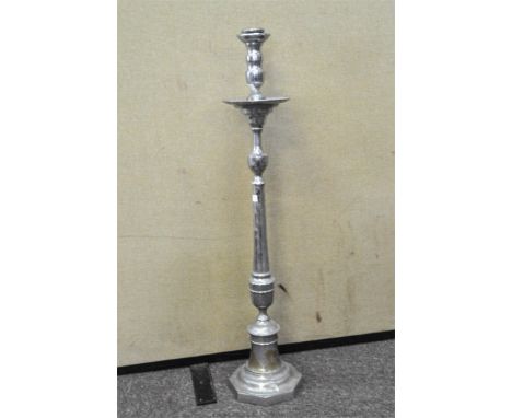 A large chrome floor standing candlestick