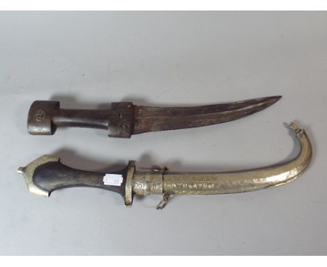 An Antique Curved Blade Wooden Handled Dagger and an Arabic Curved Blade Dagger with Plated Scabbard.