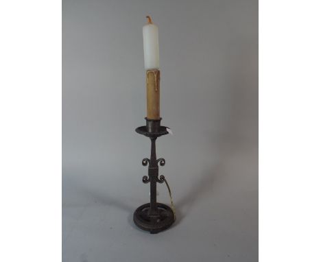 An Arts and Crafts Wrought Iron Table Lamp with Candle Bulb.