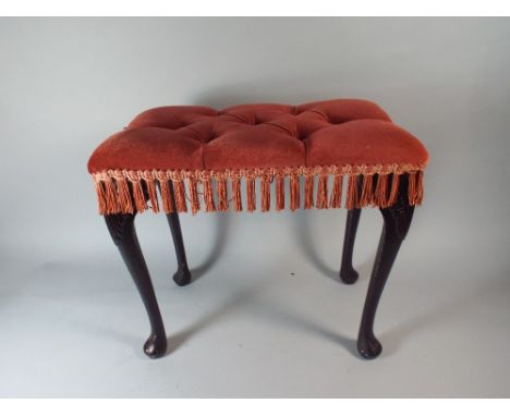 A Small Rectangular Button Upholstered Stool on Ebonised Cabriole Legs.
