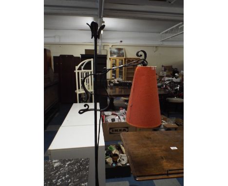 A Wrought Iron Rise and Fall Tripod Standard Lamp.