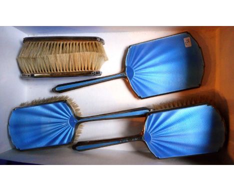 A silver and blue engine turned enamel decorated five piece mirror and brush suite, Birmingham 1933.