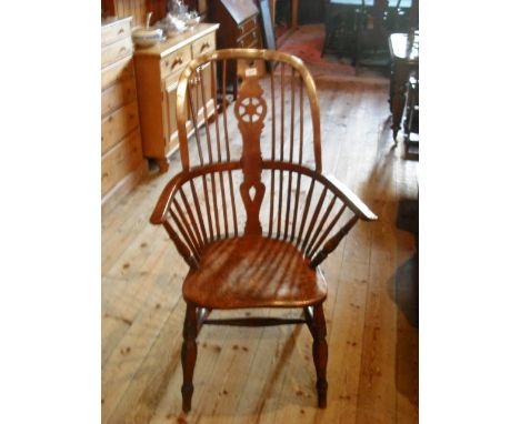 A 19th century wheel and stick back Windsor armchair.