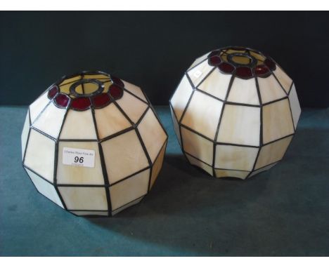 A pair of painted opaque and ruby glass ten sided spherical ceiling light shades.