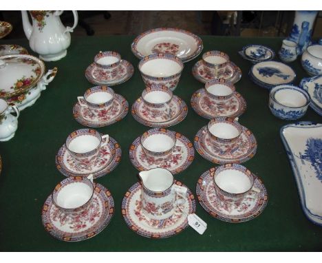 An Edwardian English tea service, a ten place setting with additions, comprising cups, saucers, tea plates, cream jug, sugar 