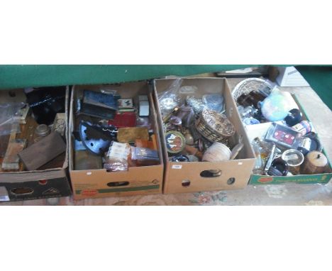 Four boxes of various items, including carved wooden animals, playing cards, wooden boxes, tourist wares, tobacco box and oth