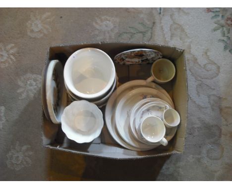A box of decorative ceramics, including a Poole Springtime part-tea service, jardinieres and other items.
