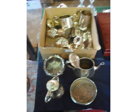 A small mixed lot of silver plate, including wine coaster, bachelor's part-tea service, sugar scuttle, christening mug and ot