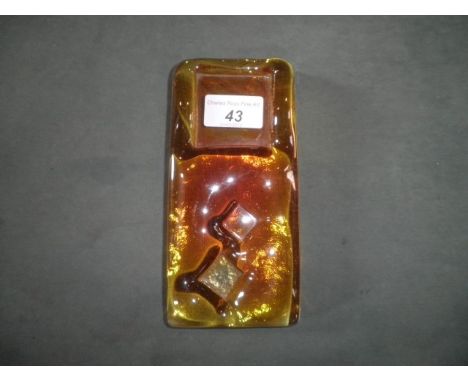 A Whitefriars architectural glass slab of rectangular form (18 x 8cm approx.), pale amber with square and lozenge impressions
