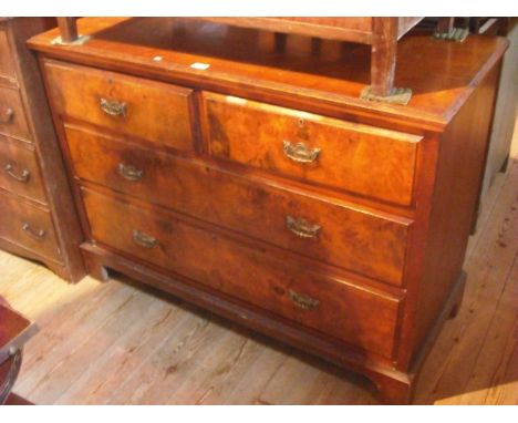 A 19th century mahogany and burr walnut veneered chest, the rectangular top with moulded edge over two short and two long dra