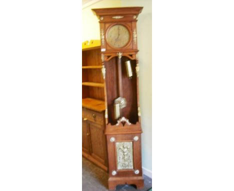 A Continental oak and gilt metal mounted longcase clock, having an eight day gong striking movement faced by gilded Arabic di