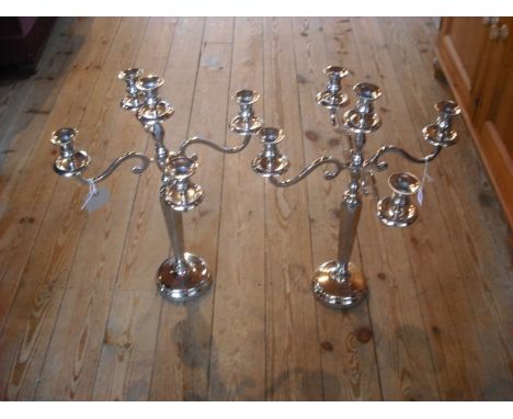 A pair of four branch, five light nickel plated table candlesticks, 62.5cm.