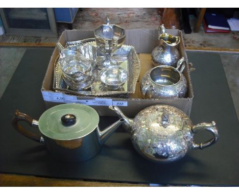 A silver teapot of oval form, having Bakelite handle and angled spout, London 1902, together with a silver trophy cup of twin