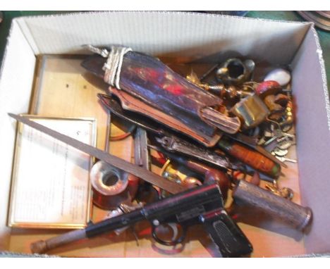 A mixed lot, including a cigarette lighter fashioned as a revolver, a Harrington Gat gun, miniature brass ornaments and other