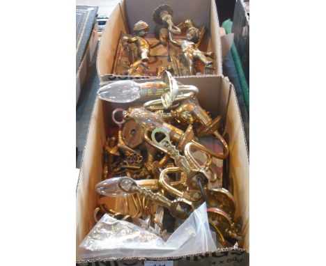 Two boxes of brass and other metalwares, including candle and wall light sconces, door furniture and other similar items.