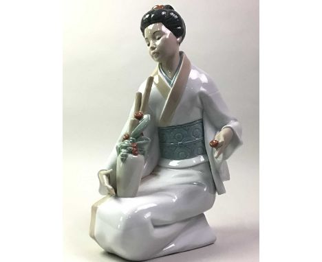 NAO FIGURE OF A GEISHA, modelled kneeling33cm high