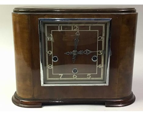 ROBERT STEWART OF GLASGOW ART DECO MANTEL CLOCK, MID 20TH CENTURY with brass mechanism, the clock face of square form on rais