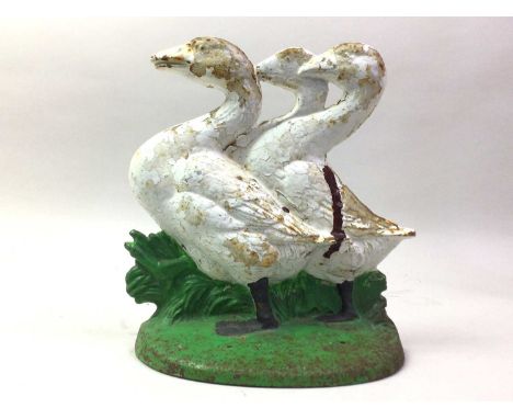 CAST IRON DOORSTOP, depicting three ducks, stamped CN to reverse20cm tall x 19cm wide. Rusting throughout the item stating to