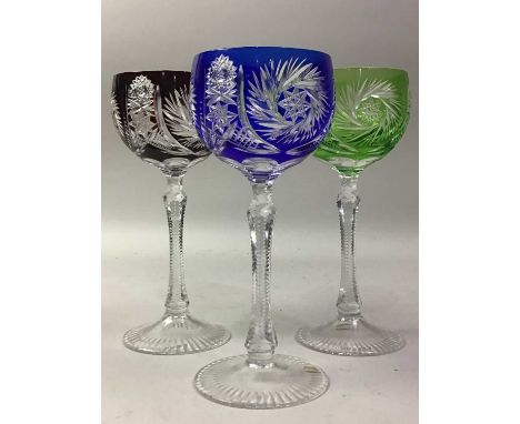 SET OF SIX GERMAN CRYSTAL HARLEQUIN HOCK GLASSES, ALONG WITH SIX MATCHING LIQUEUR GLASSES  in shades of green, amethyst, blue