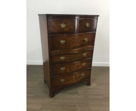 WALNUT SERPENTINE FRONT CHEST, with two short over four long drawers, on bracket feet110cm high, 71cm wide
