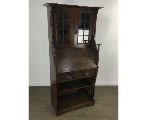 STAINED OAK ARTS & CRAFTS BUREAU BOOKCASE, with two glazed doors over drop front with single drawer and open shelves164cm hig