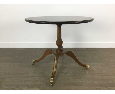 TWO REPRODUCTION MAHOGANY CIRCULAR OCCASIONAL TABLES, each on tripod supports, one on brass castorsone 53cm x 63cm Qty: 2